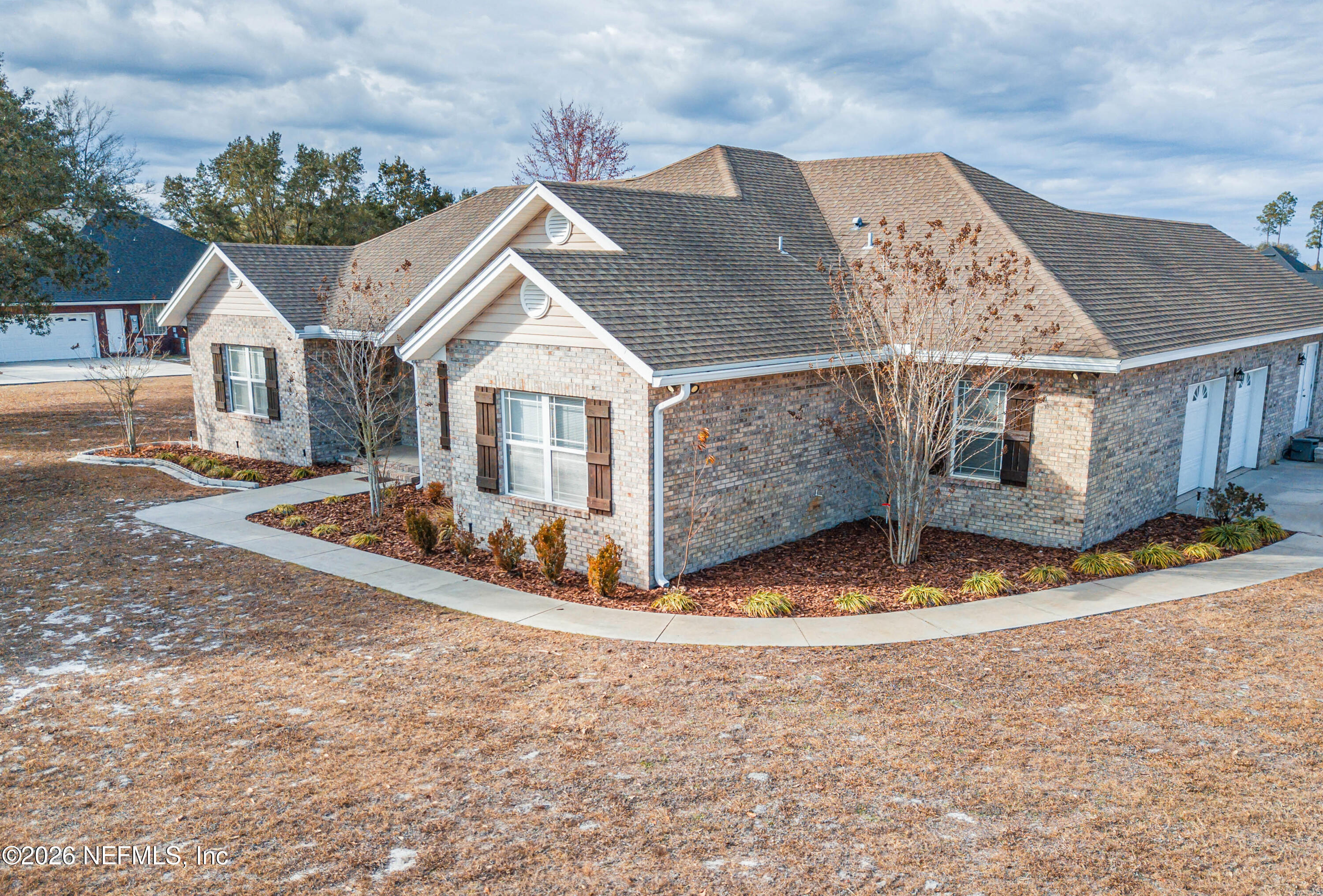 8139 Hunters Ridge South Glen St. Mary, FL 32040 - Photo 3 of 49 a view of a house with a yard