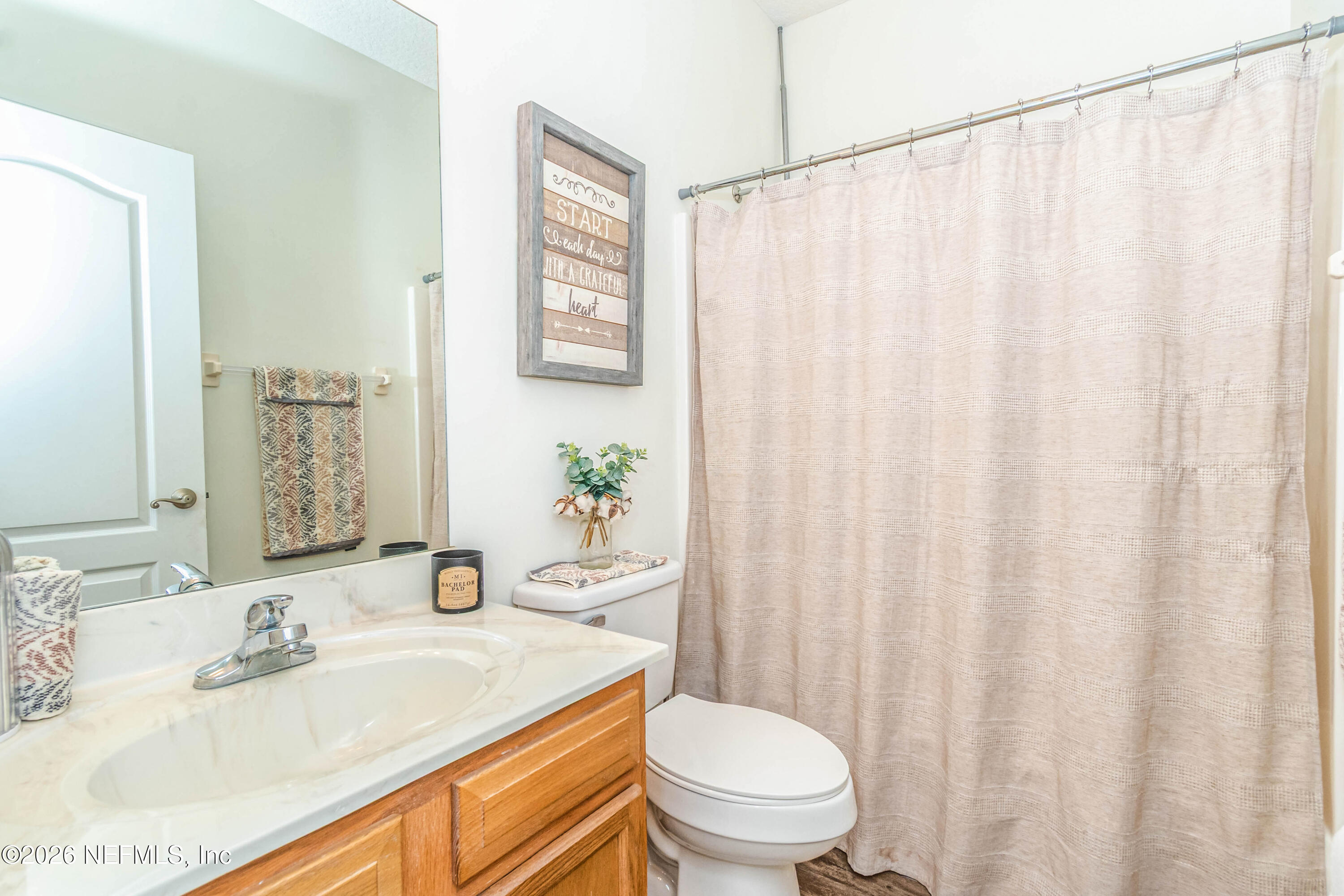 8139 Hunters Ridge South Glen St. Mary, FL 32040 - Photo 31 of 49 a bathroom with a granite countertop sink and a mirror