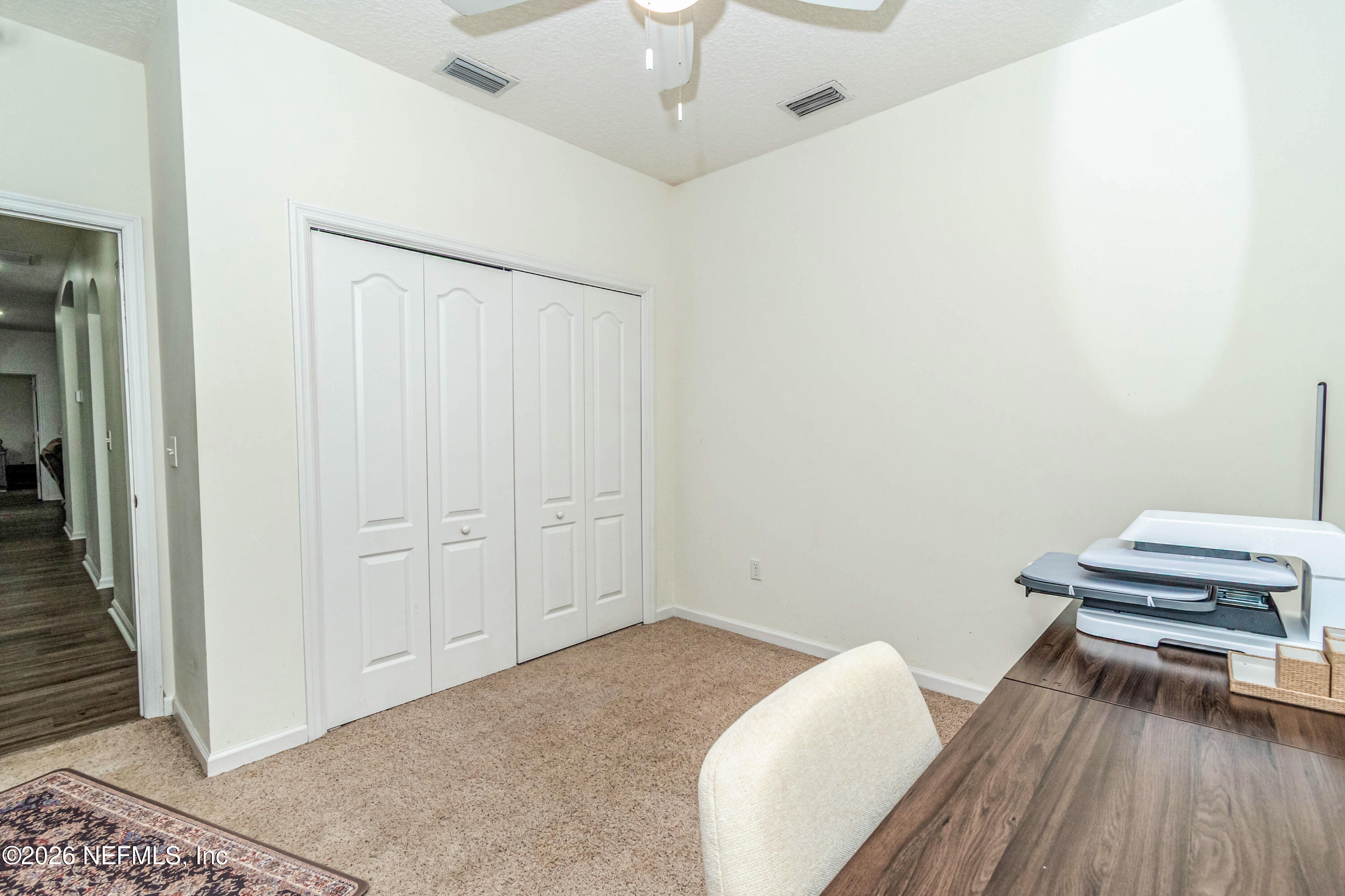 8139 Hunters Ridge South Glen St. Mary, FL 32040 - Photo 33 of 49 a view of a room with wooden floor and bathroom