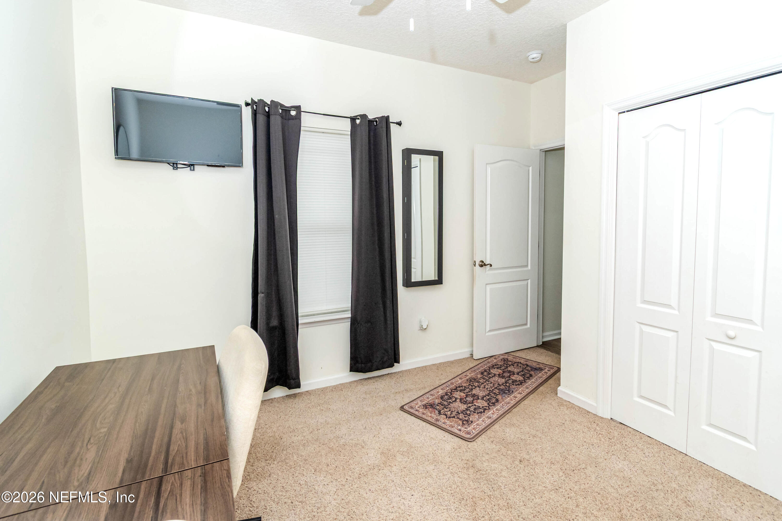8139 Hunters Ridge South Glen St. Mary, FL 32040 - Photo 34 of 49 a view of walk in closet with clothes and shoes