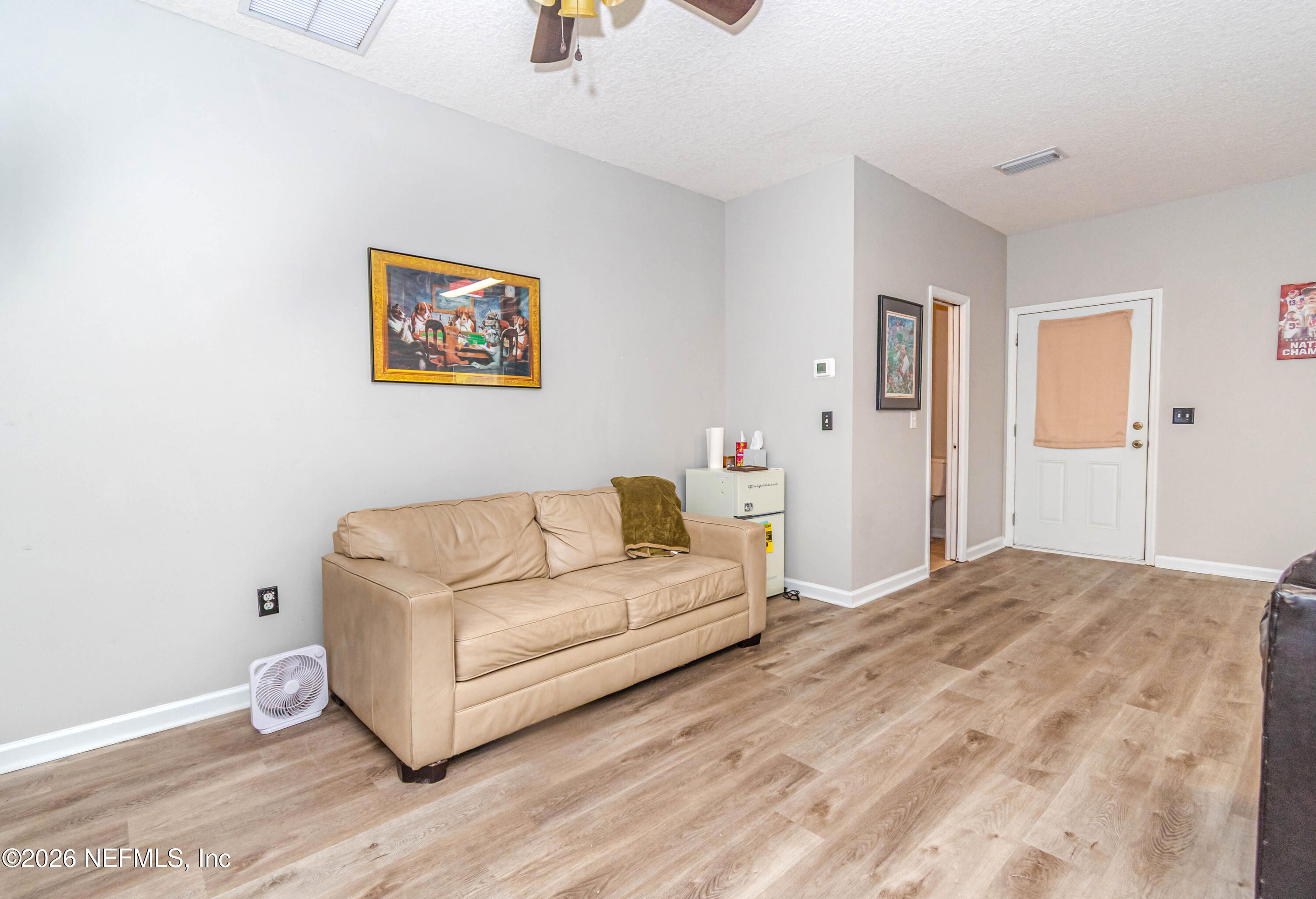 8139 Hunters Ridge South Glen St. Mary, FL 32040 - Photo 40 of 49 a living room with furniture and a wooden floor