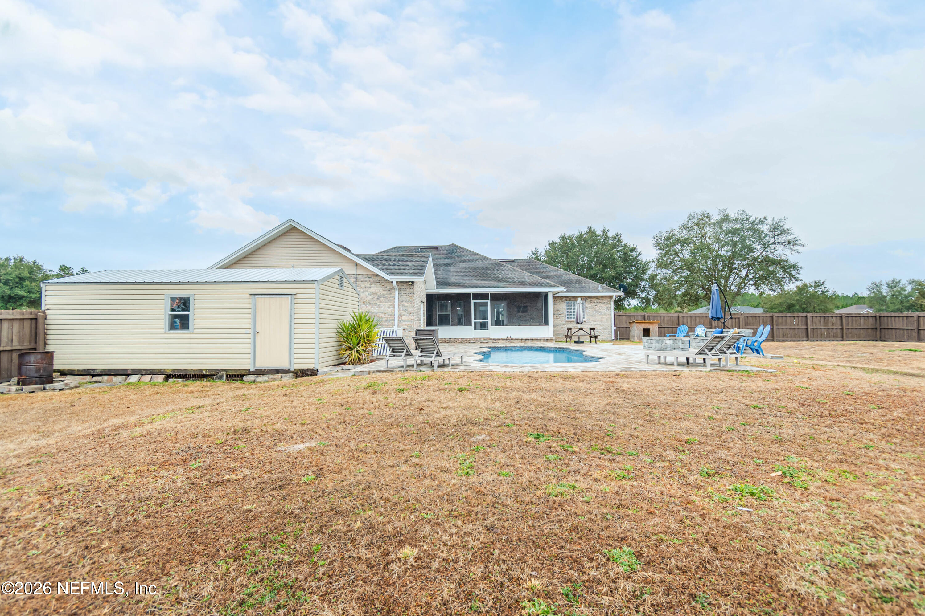 8139 Hunters Ridge South Glen St. Mary, FL 32040 - Photo 44 of 49 a front view of a house with a yard and garage