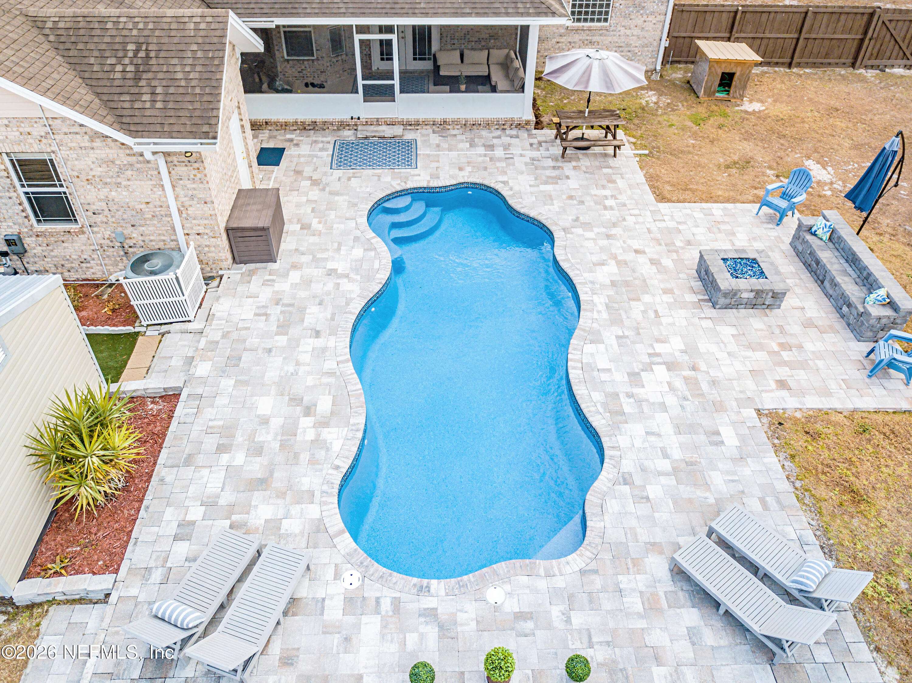 8139 Hunters Ridge South Glen St. Mary, FL 32040 - Photo 45 of 49 a view of a swimming pool with outdoor seating