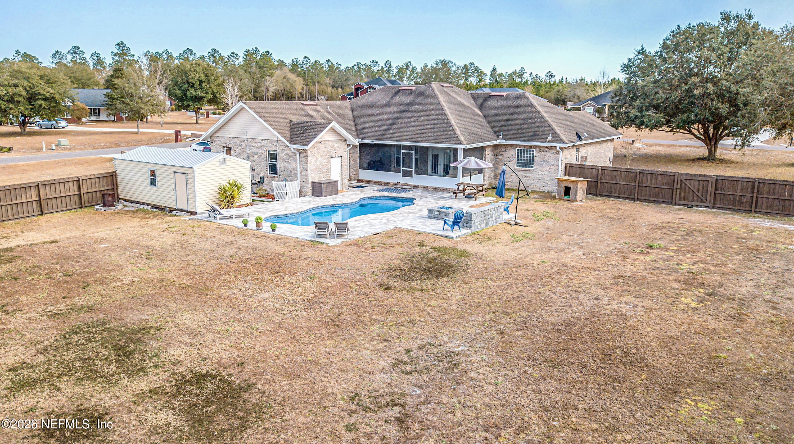 8139 Hunters Ridge South Glen St. Mary, FL 32040 - Photo 5 of 49 an aerial view of a house with swimming pool and sitting area