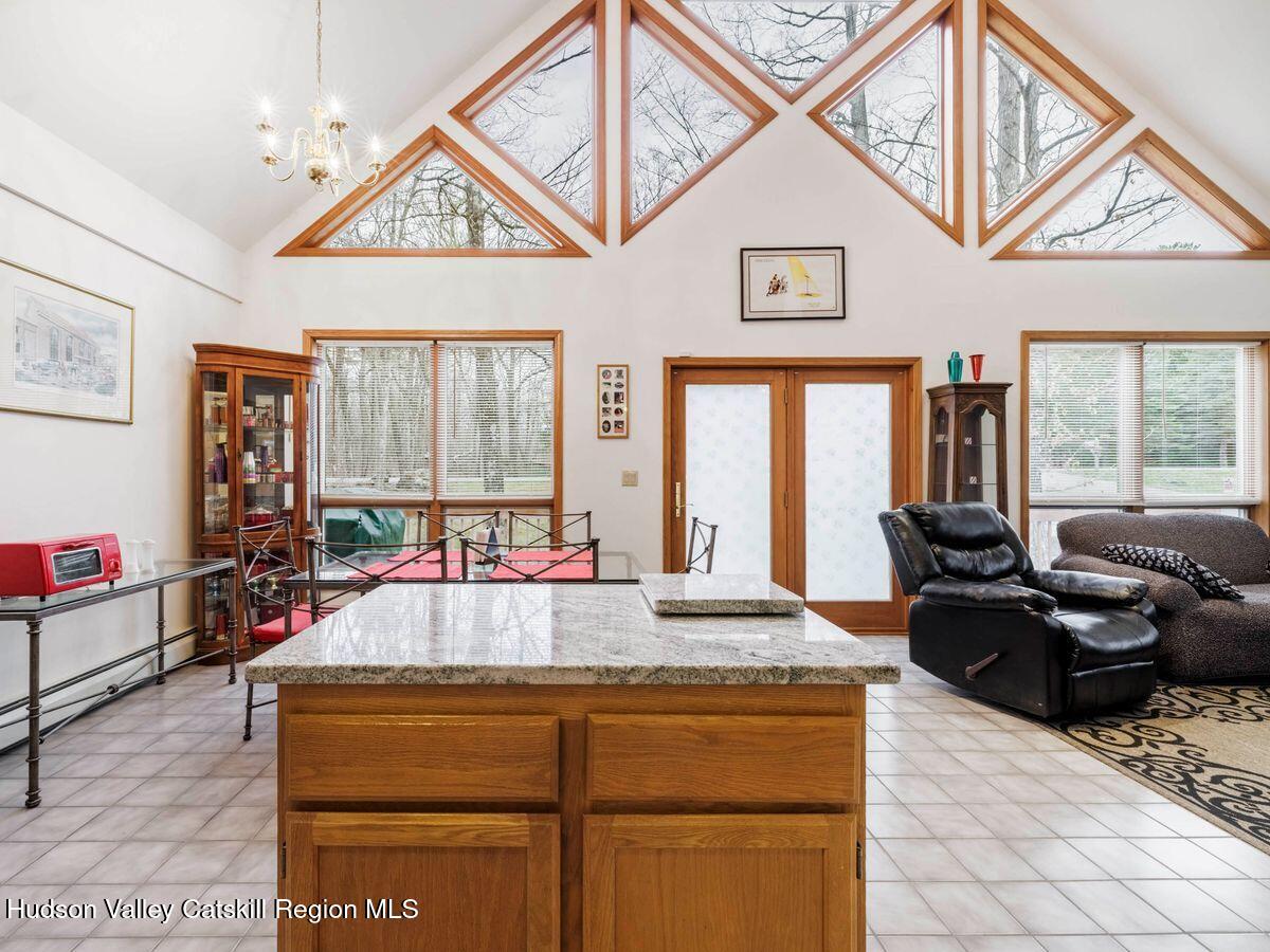 831 North Chodikee Lake Road Highland, NY 12528 - Photo 11 of 31 a living room with granite countertop furniture and a large window