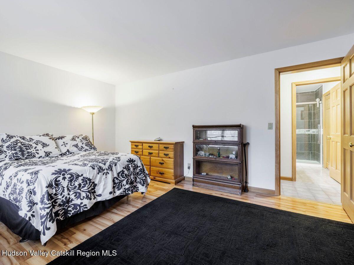 831 North Chodikee Lake Road Highland, NY 12528 - Photo 12 of 31 a bedroom with bed and window