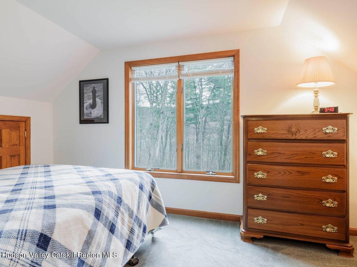 831 North Chodikee Lake Road Highland, NY 12528 - Photo 14 of 31 a bedroom with a bed and a window