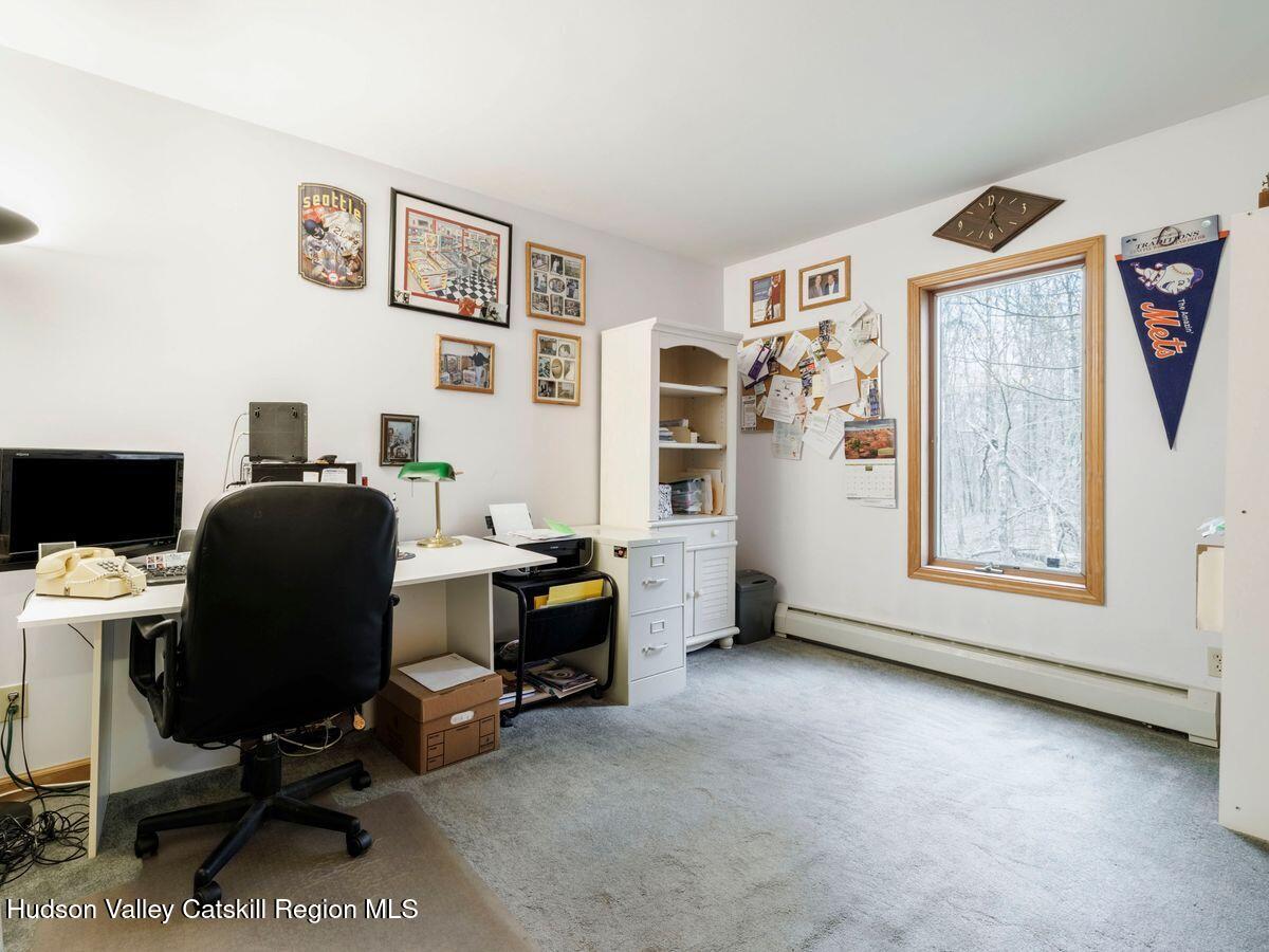 831 North Chodikee Lake Road Highland, NY 12528 - Photo 17 of 31 a view of a workspace with furniture and a window
