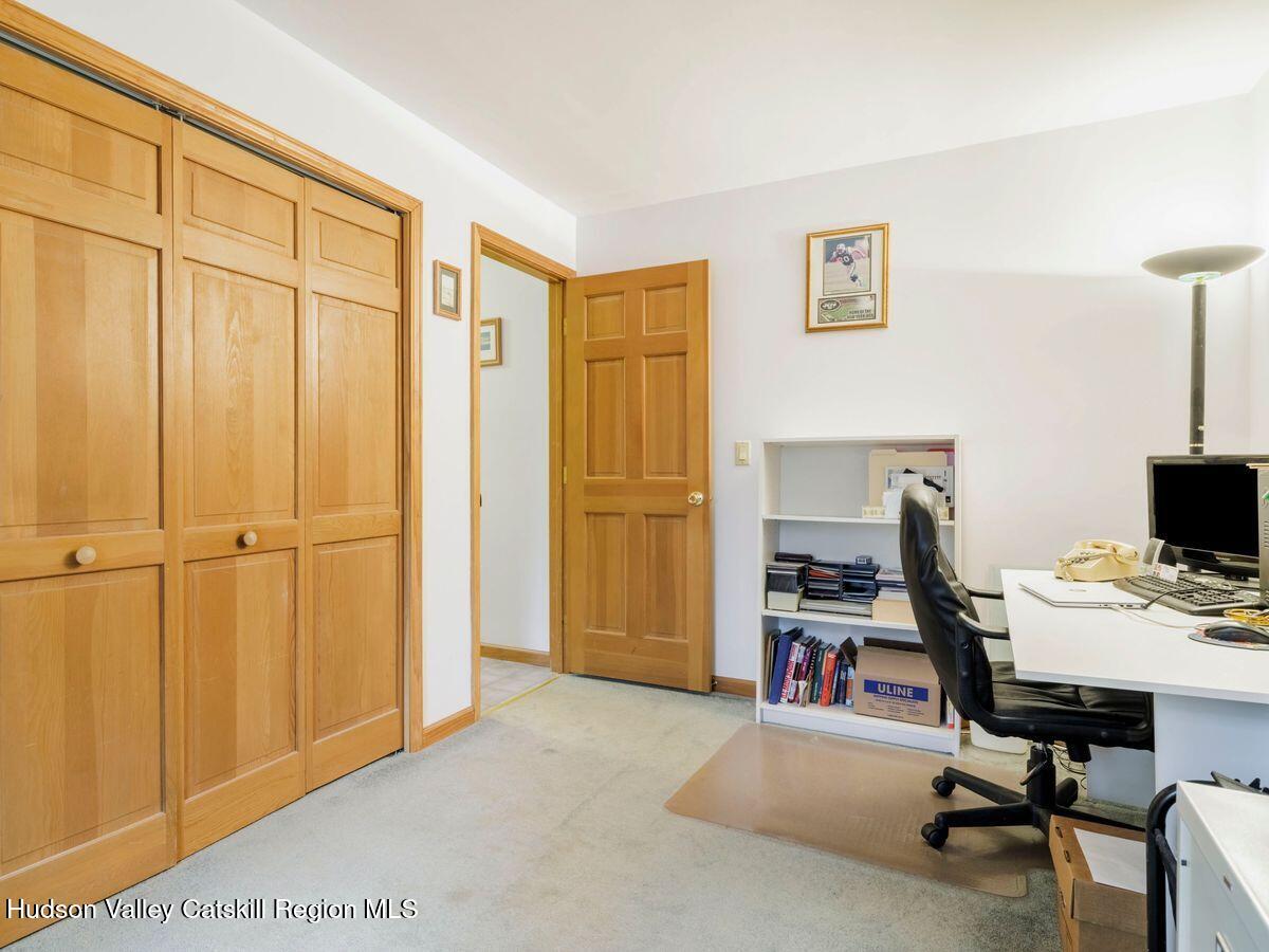 831 North Chodikee Lake Road Highland, NY 12528 - Photo 22 of 31 a view of a workspace with furniture and a window
