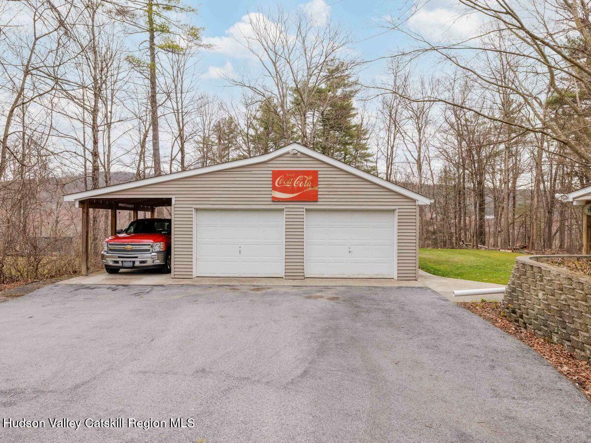 831 North Chodikee Lake Road Highland, NY 12528 - Photo 28 of 31 a view of a house with a yard and garage