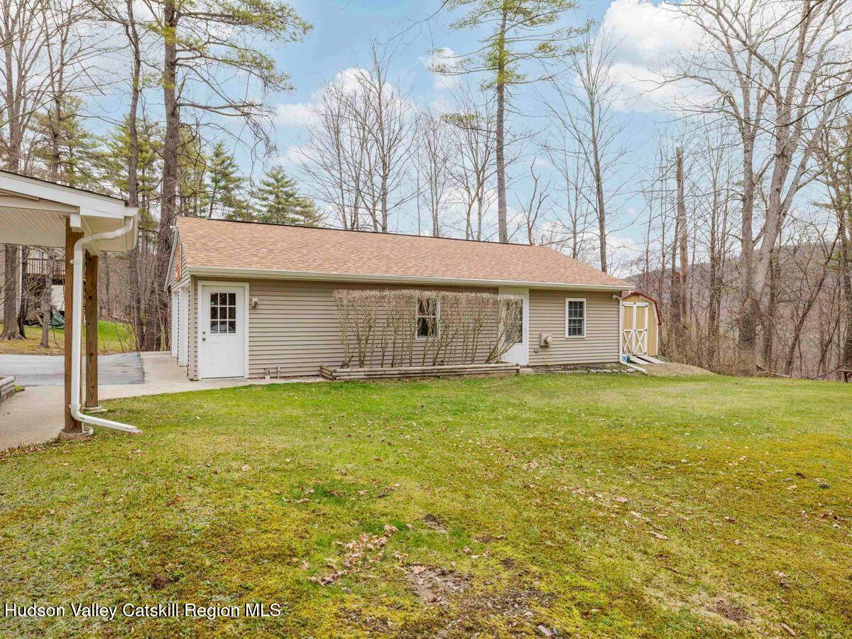 831 North Chodikee Lake Road Highland, NY 12528 - Photo 29 of 31 a front view of a house with a garden