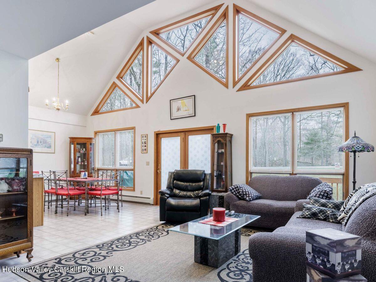 831 North Chodikee Lake Road Highland, NY 12528 - Photo 9 of 31 a living room with furniture and a large window