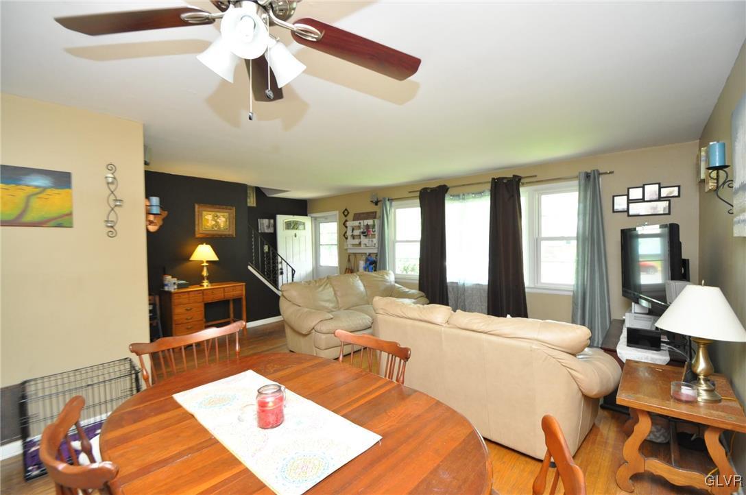 37 Ridge Avenue Telford, PA 18969 - Photo 4 of 18 a large bedroom with a bed and a chandelier