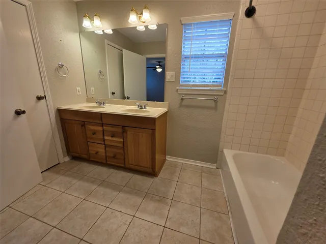 a bathroom with a sink a vanity and a mirror