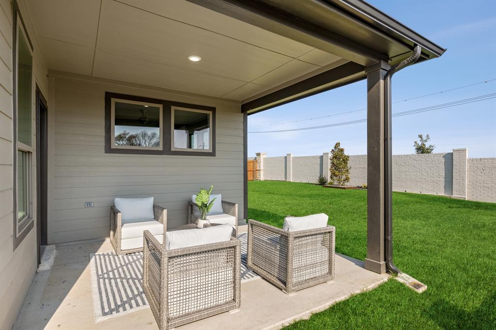 1129 Del Rio Drive Lavon, TX 75166 - Photo 28 of 28 Covered Patio in the Wimbledon home plan by Trophy Signature Homes – REPRESENTATIVE PHOTO