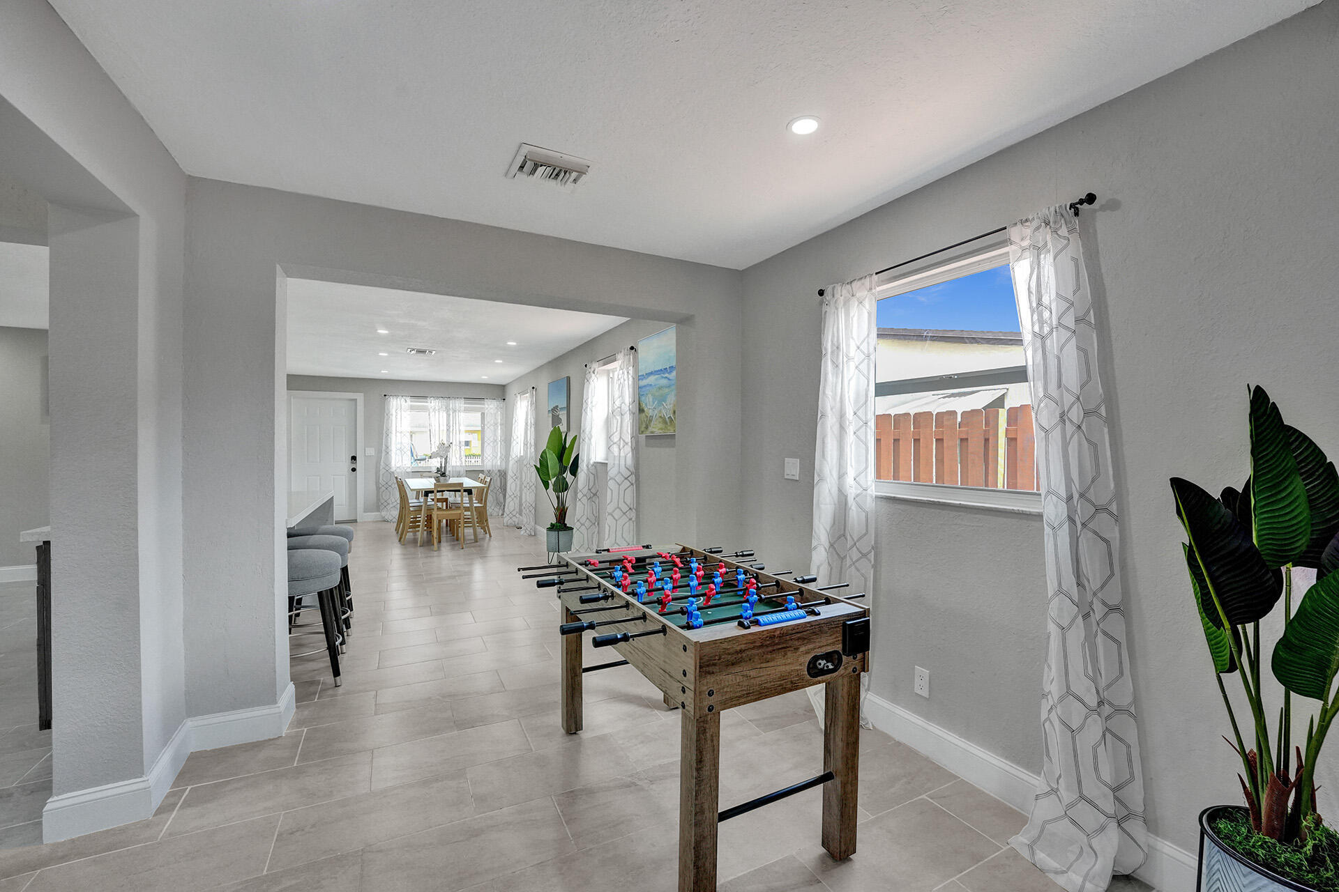 337 Southwest 8th Avenue Delray Beach, FL 33444 - Photo 17 of 48 a hallway with dining table and chairs