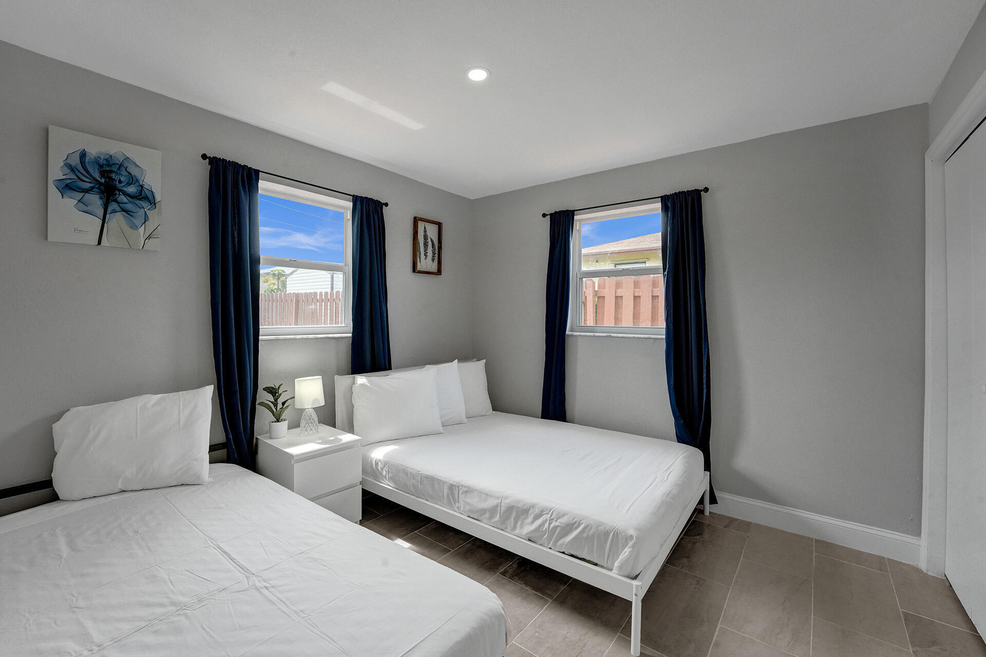 337 Southwest 8th Avenue Delray Beach, FL 33444 - Photo 20 of 48 a bedroom with a large bed and a window