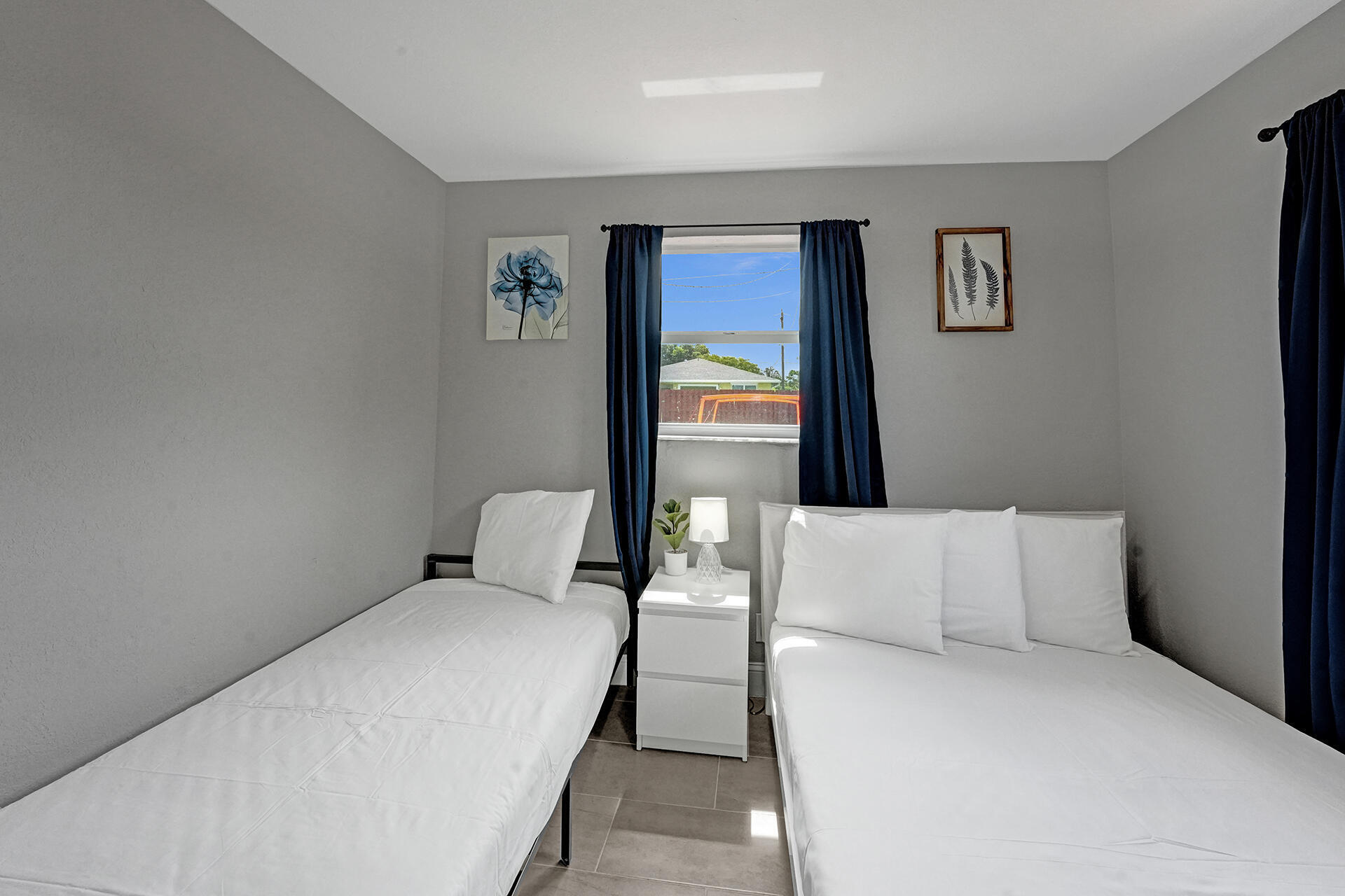 337 Southwest 8th Avenue Delray Beach, FL 33444 - Photo 23 of 48 a bedroom with a bed and window