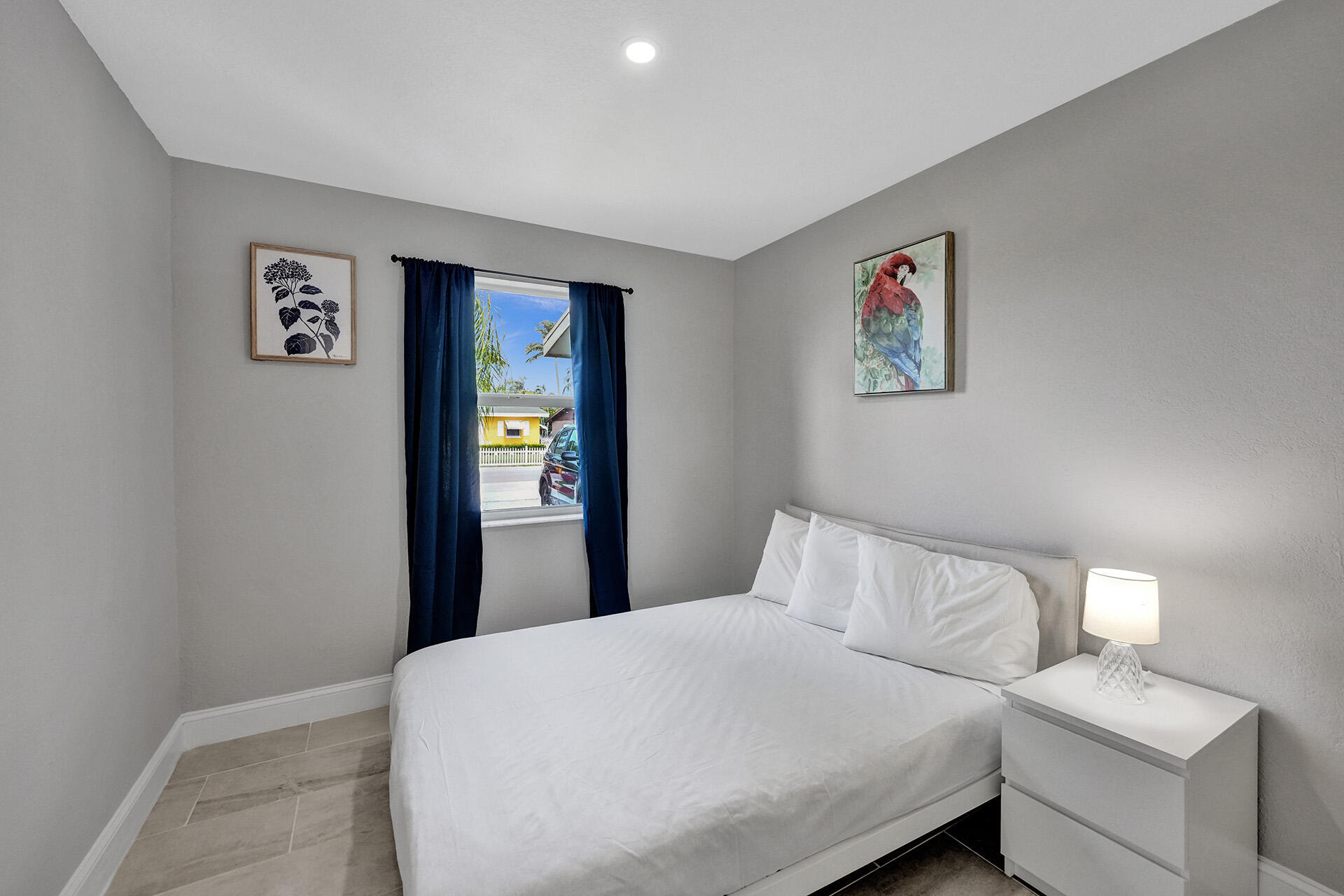 337 Southwest 8th Avenue Delray Beach, FL 33444 - Photo 35 of 48 a bedroom with a bed and painting on the wall