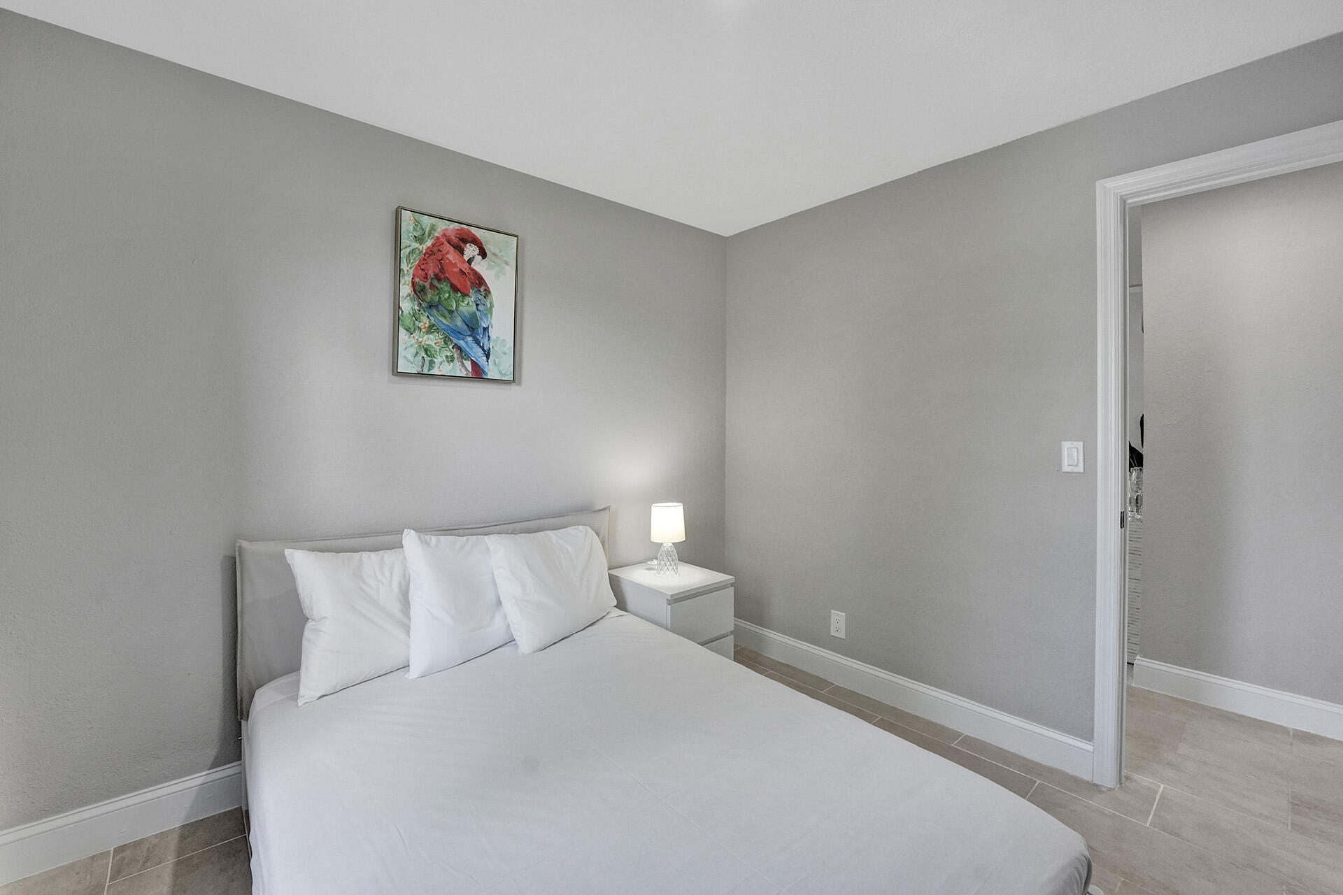 337 Southwest 8th Avenue Delray Beach, FL 33444 - Photo 36 of 48 a bedroom with a bed and a painting on the wall