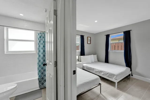 a bathroom with a toilet a sink and bathtub