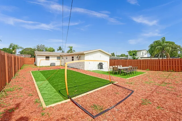 a house view with a garden space