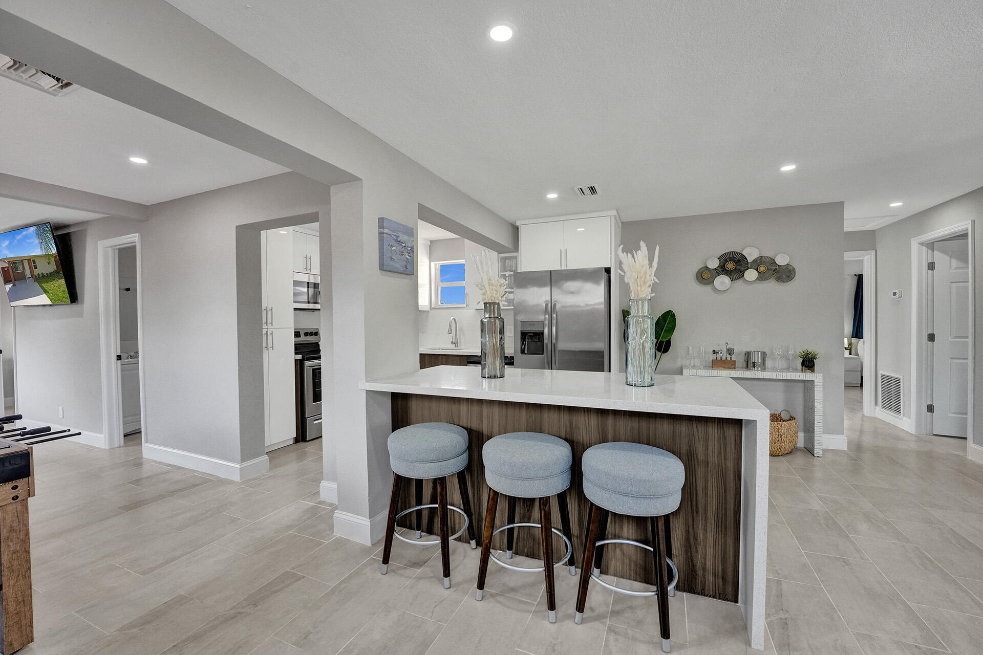 337 Southwest 8th Avenue Delray Beach, FL 33444 - Photo 9 of 48 a dining hall with stainless steel appliances a table and chairs in it