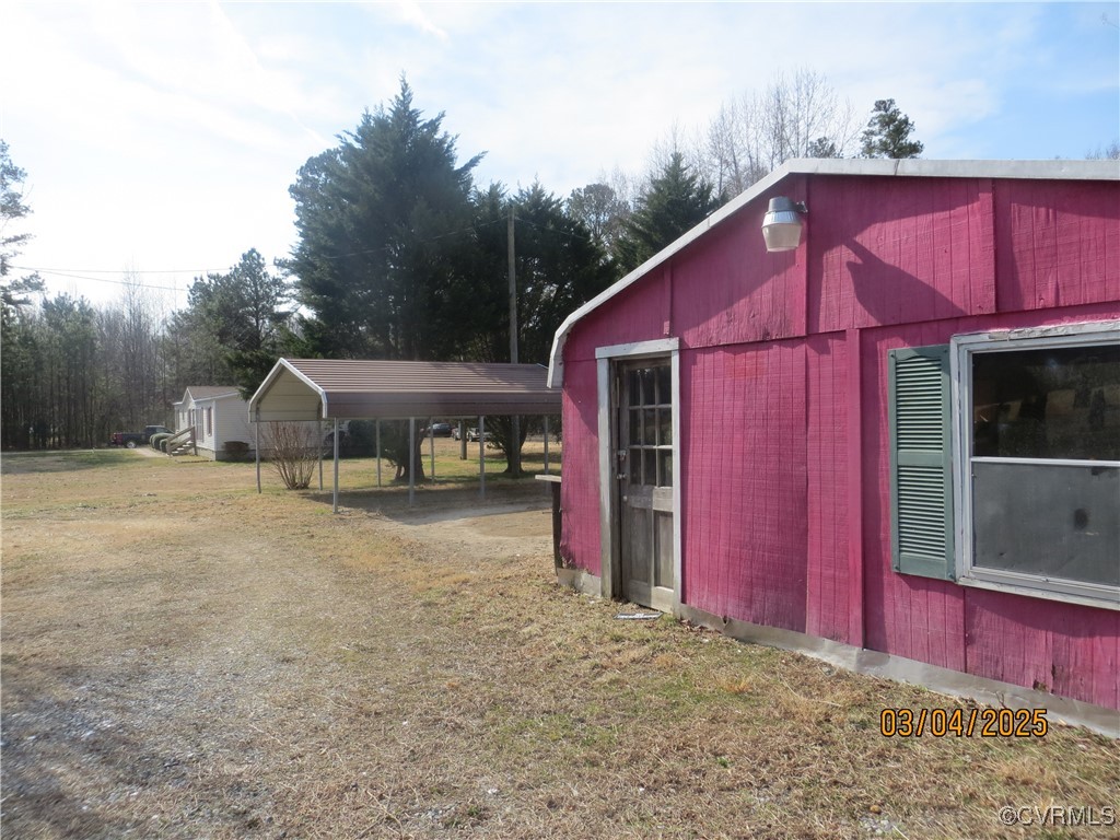 3042 Lara Road Lancaster, VA 22503 - Photo 3 of 15 a view of a house with a yard