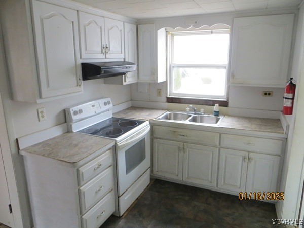 3042 Lara Road Lancaster, VA 22503 - Photo 4 of 15 a view of cabinets a sink and a stove in a kitchen