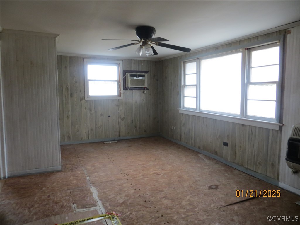 3042 Lara Road Lancaster, VA 22503 - Photo 6 of 15 an empty room with windows and ceiling fan