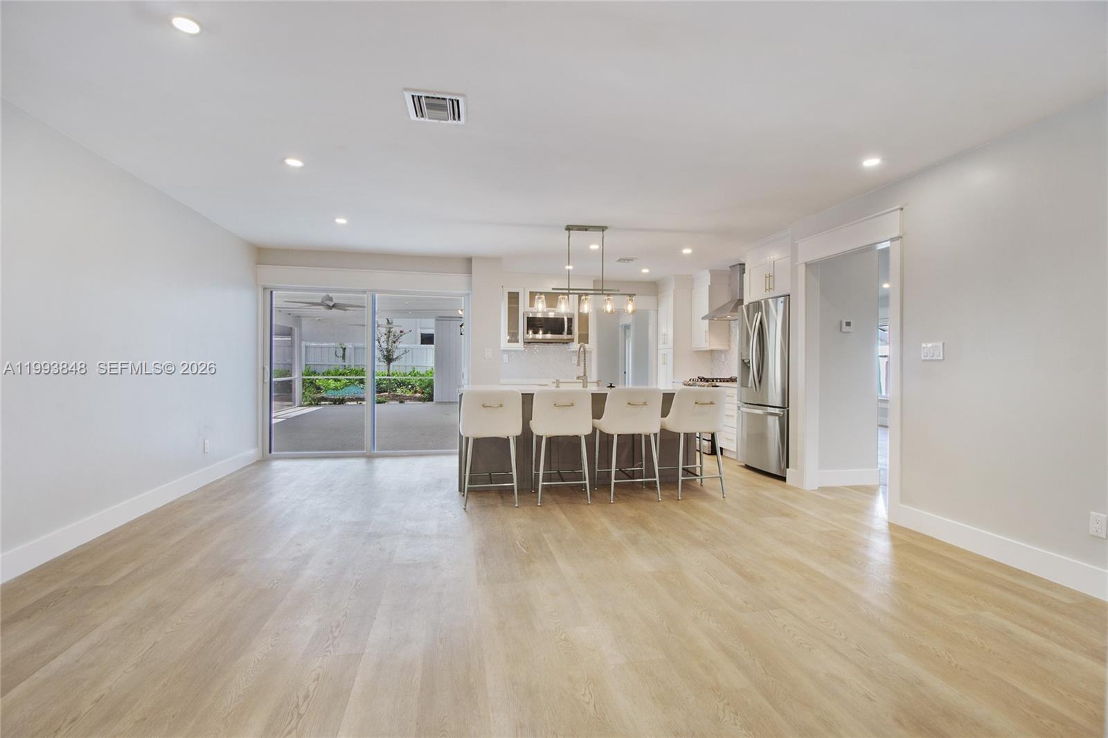 11011 Southwest 110th Road Miami, FL 33176 - Photo 12 of 15 a view of work space with wooden floor and furniture
