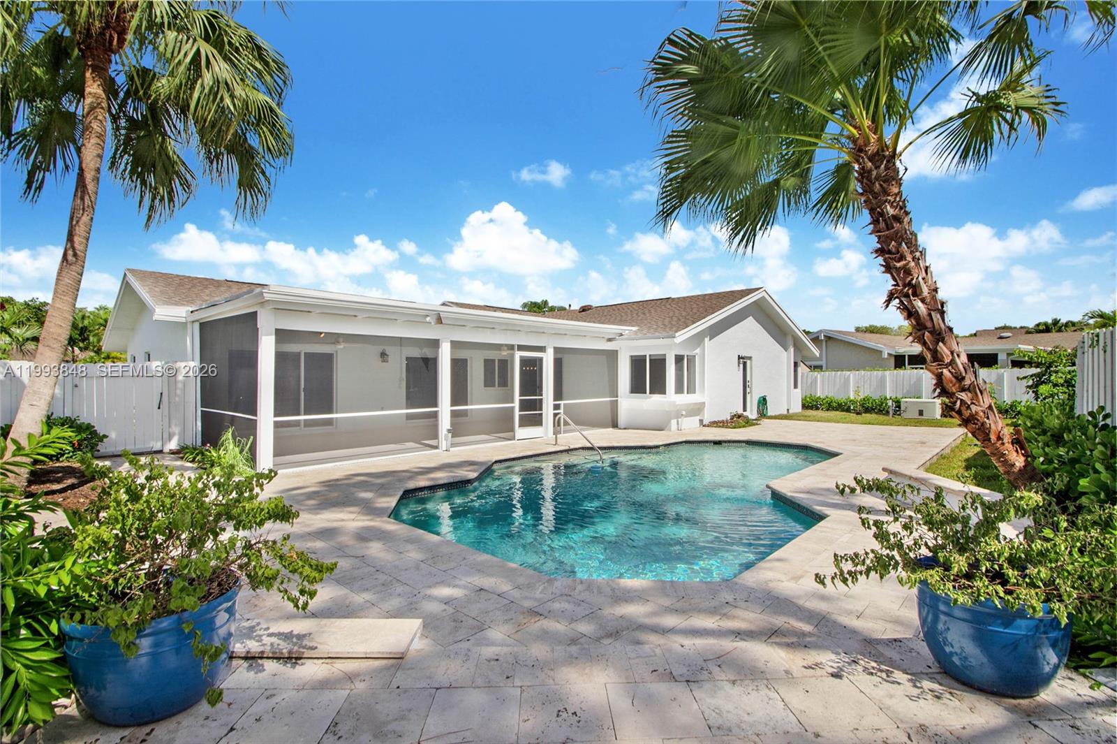 11011 Southwest 110th Road Miami, FL 33176 - Photo 2 of 15 a front view of a house with a garden