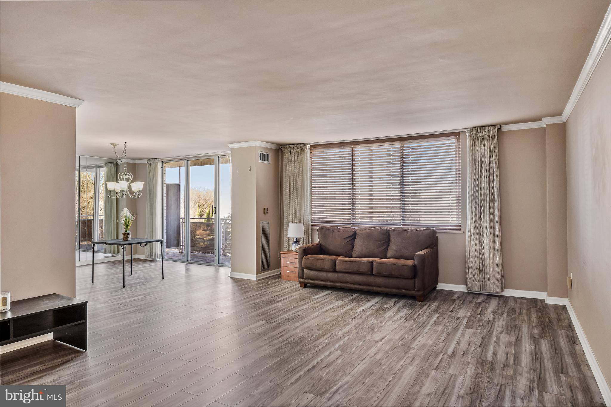 1840 Frontage Road, Unit 404 Cherry Hill, NJ 08034 - Photo 12 of 28 a living room with furniture and a wooden floor