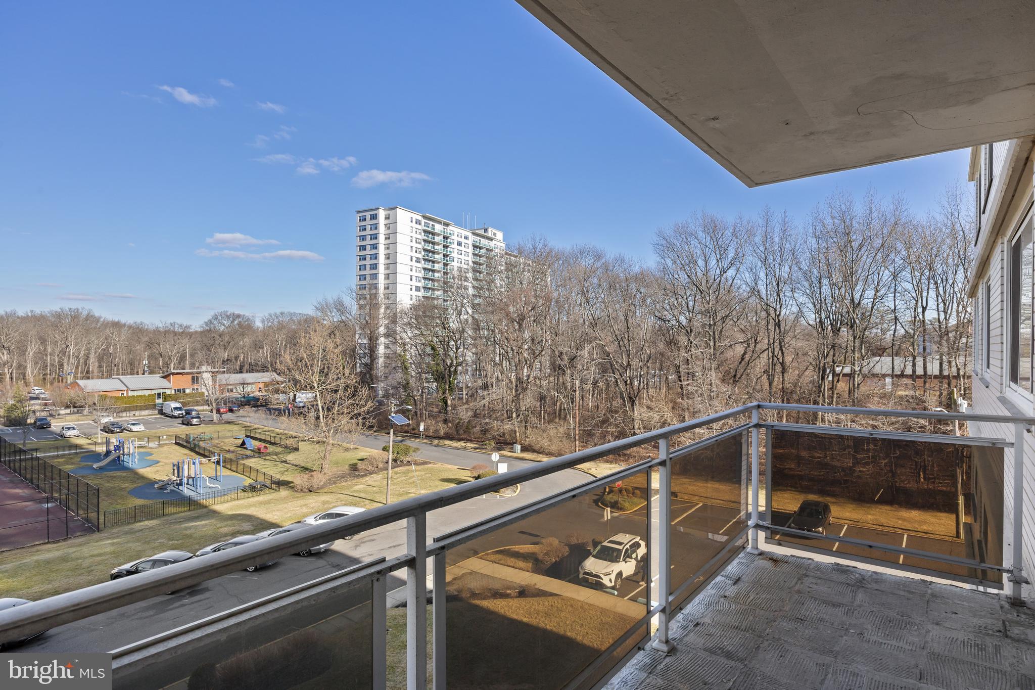 1840 Frontage Road, Unit 404 Cherry Hill, NJ 08034 - Photo 22 of 28 a view of roof deck with tall trees