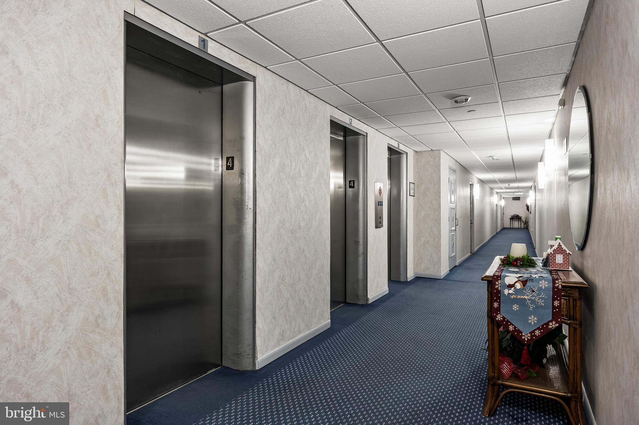 1840 Frontage Road, Unit 404 Cherry Hill, NJ 08034 - Photo 23 of 28 a view of a hallway with a refrigerator and a window