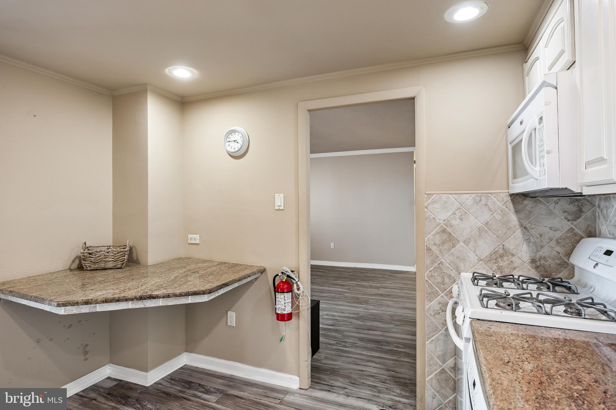1840 Frontage Road, Unit 404 Cherry Hill, NJ 08034 - Photo 8 of 28 a kitchen with granite countertop a sink and a stove