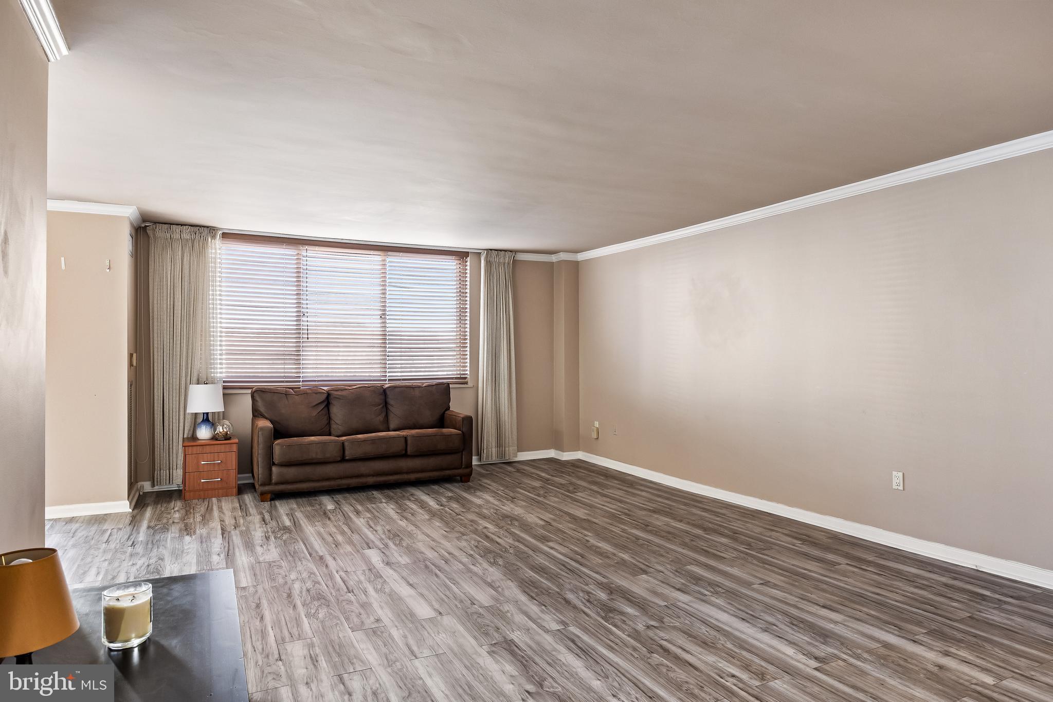 1840 Frontage Road, Unit 404 Cherry Hill, NJ 08034 - Photo 10 of 28 a living room with furniture and a large window