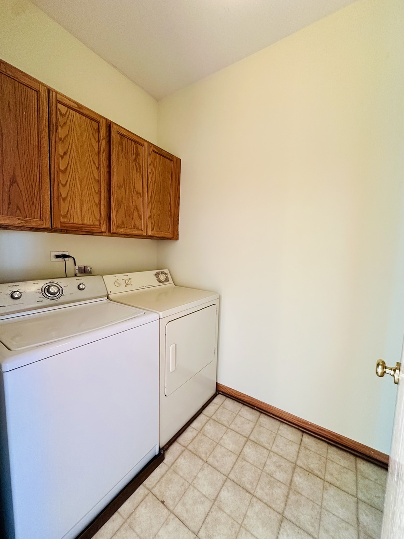9499 Harrison Street, Unit 9499 Des Plaines, IL 60016 - Photo 17 of 17 a utility room with dryer and washer
