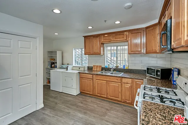 a view of hallway with wooden floor