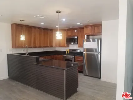 a bathroom with a toilet a sink and bathtub