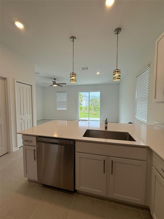 2691 Skyline Loop Kissimmee, FL 34758 - Photo 12 of 27 a kitchen with a sink and white cabinets