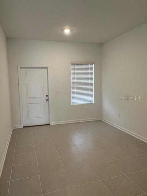 2691 Skyline Loop Kissimmee, FL 34758 - Photo 19 of 27 an empty room with a empty space and windows