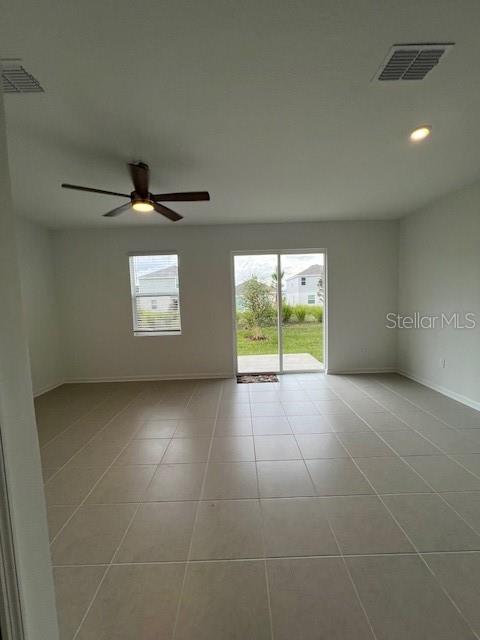 2691 Skyline Loop Kissimmee, FL 34758 - Photo 20 of 27 a view of an empty room with a window