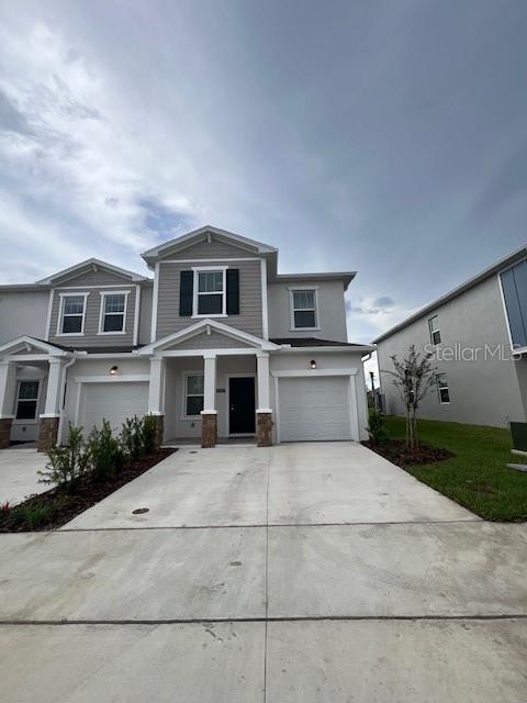 2691 Skyline Loop Kissimmee, FL 34758 - Photo 2 of 27 a front view of house with yard