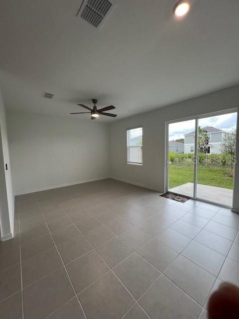 2691 Skyline Loop Kissimmee, FL 34758 - Photo 21 of 27 a view of an empty room with a window