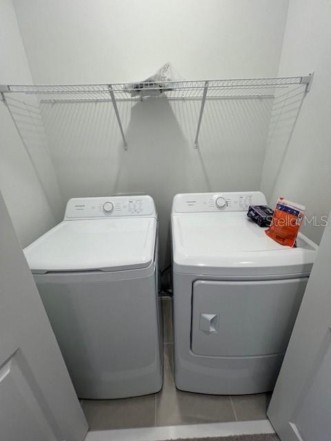 2691 Skyline Loop Kissimmee, FL 34758 - Photo 23 of 27 a utility room with dryer and washer