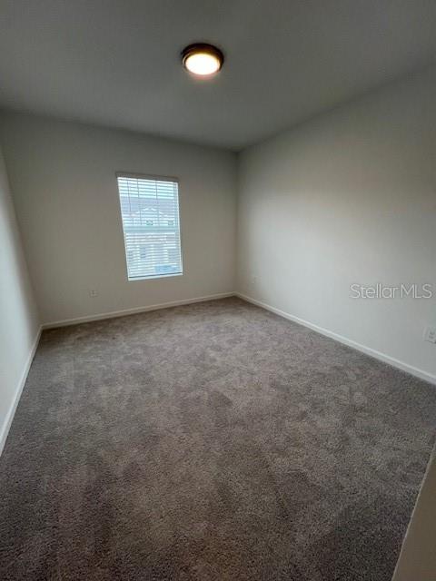 2691 Skyline Loop Kissimmee, FL 34758 - Photo 26 of 27 an empty room with a window