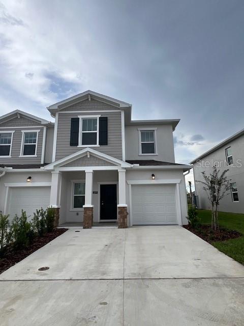 2691 Skyline Loop Kissimmee, FL 34758 - Photo 4 of 27 a front view of a house with yard