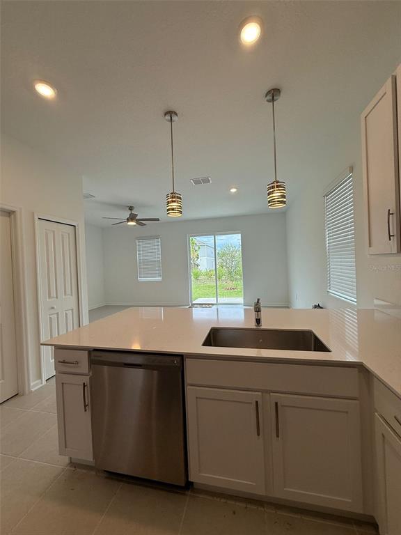 2691 Skyline Loop Kissimmee, FL 34758 - Photo 10 of 27 a kitchen with a sink and cabinets
