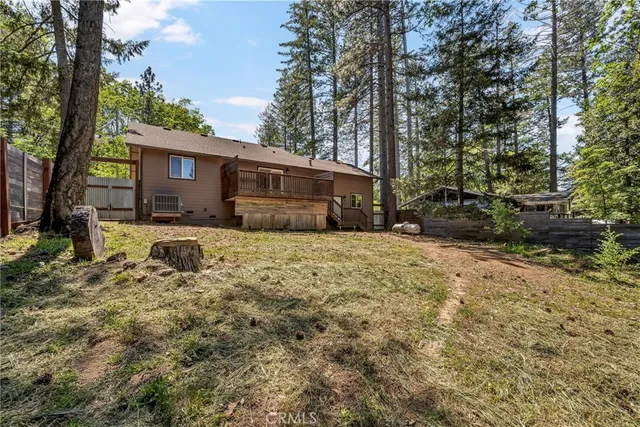 a front view of a house with a yard covered with snow in front of house